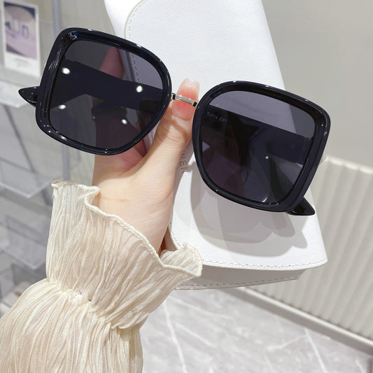 Black oversized square sunglasses by Fabufabu Design Store, featuring bold frames and tinted lenses for a stylish look.